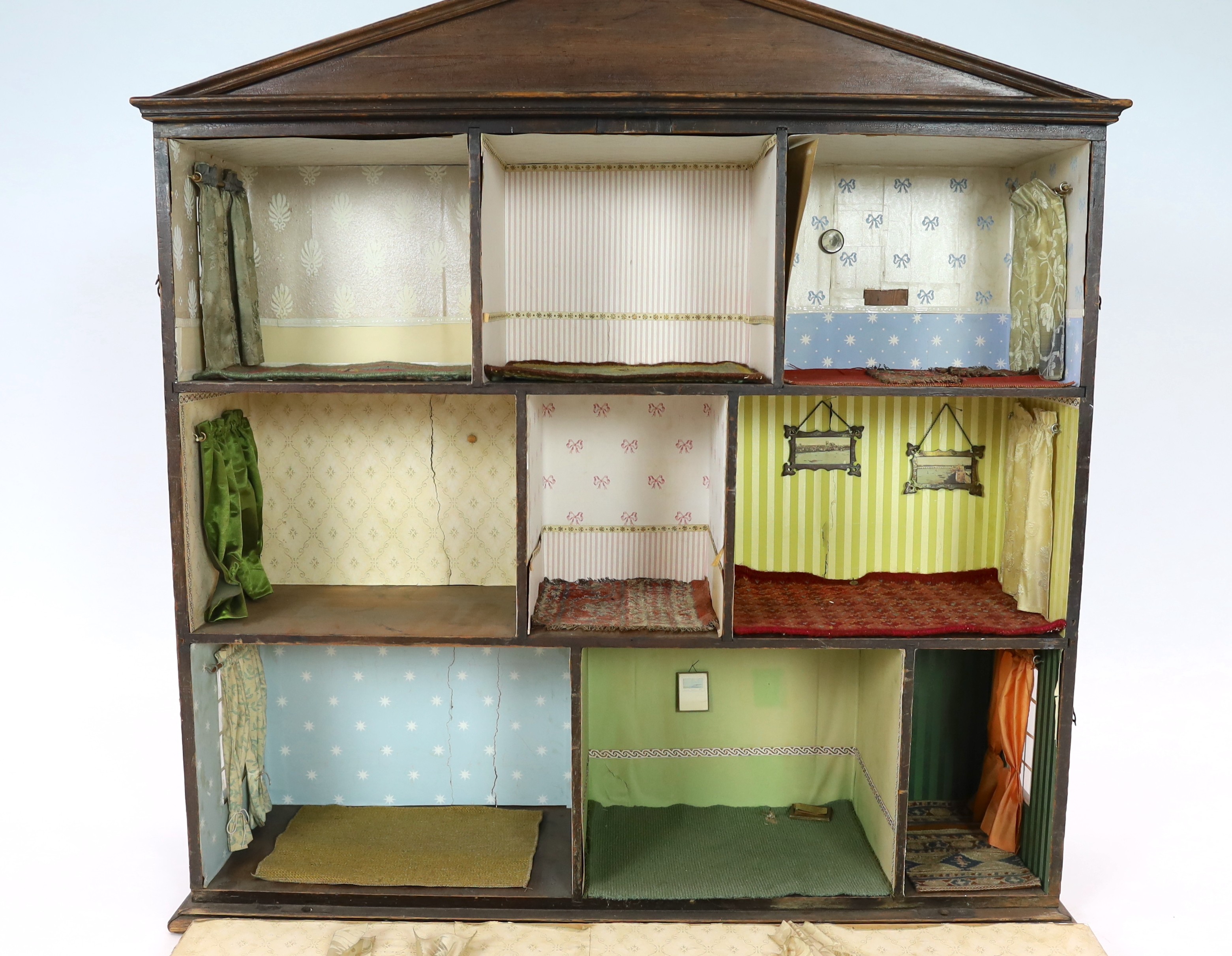 A furnished English dolls’ house, circa 1810-20, 104cm high